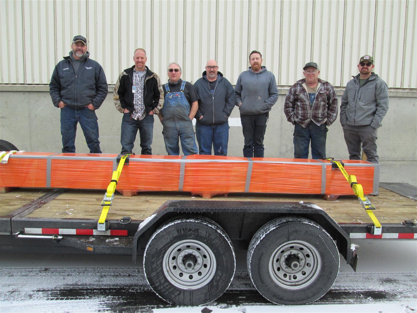 Spencer Esch (left), maintenance worker and equipment operator at Crystal Dam, drove more than 2,200 miles to pick up the pieces made by Grand Coulee machinists (pictured second from left): Justin Miller, Michael Dennis, Keith Faul, Kyle Kuhlmann, Timothy Hagerup and Michael Gause.